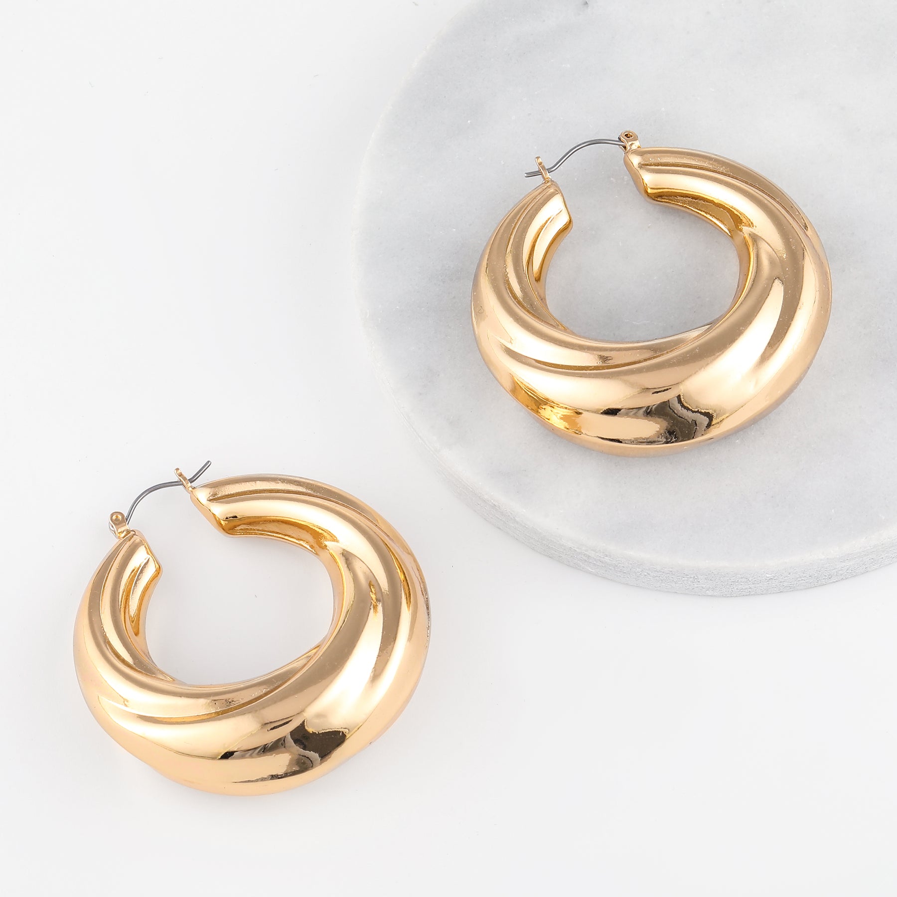 Round Twisted Hoop Earrings | Earrings by DORADO