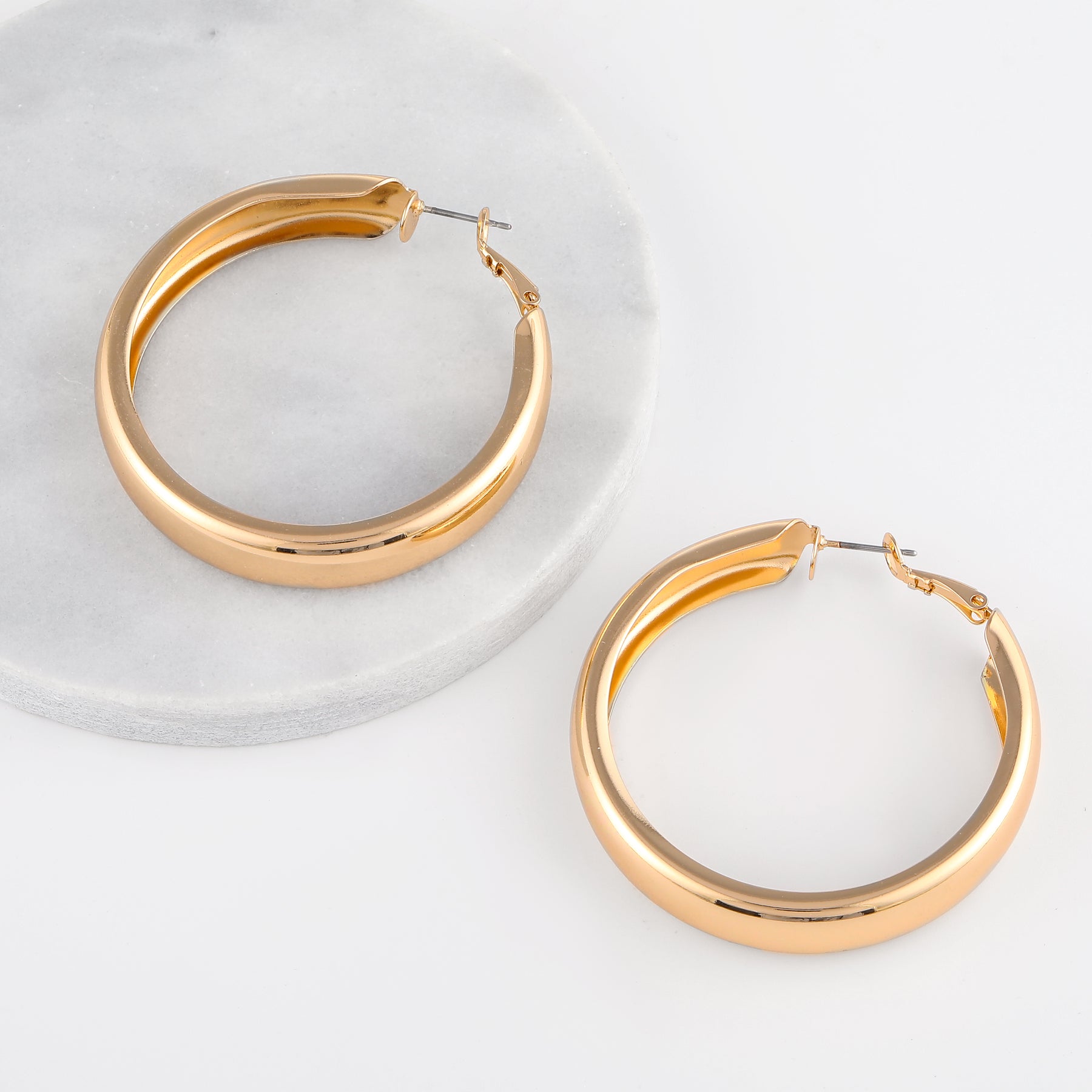 Chunky Hollow Hoop Earrings | Earrings by DORADO