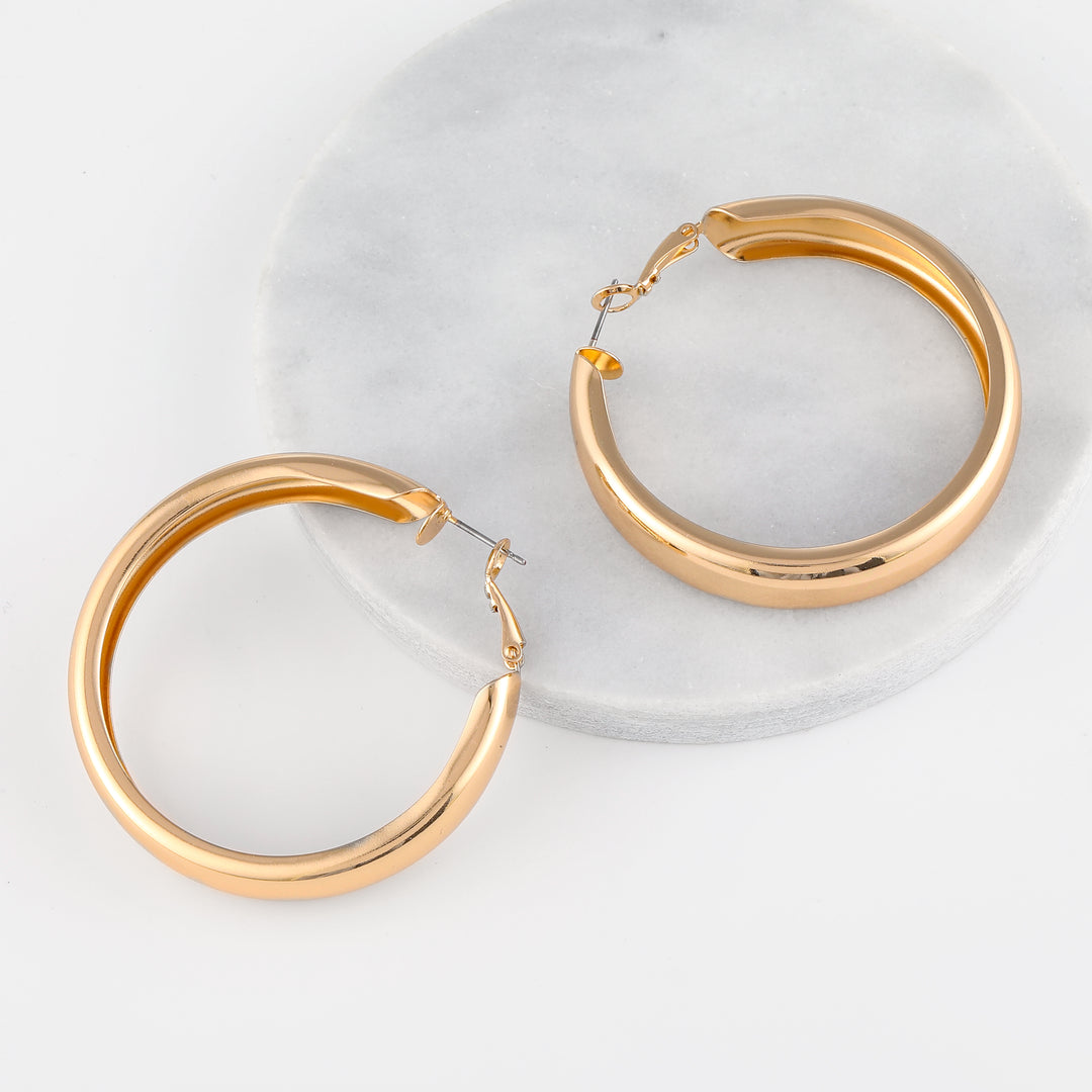 Chunky Hollow Hoop Earrings | Earrings by DORADO