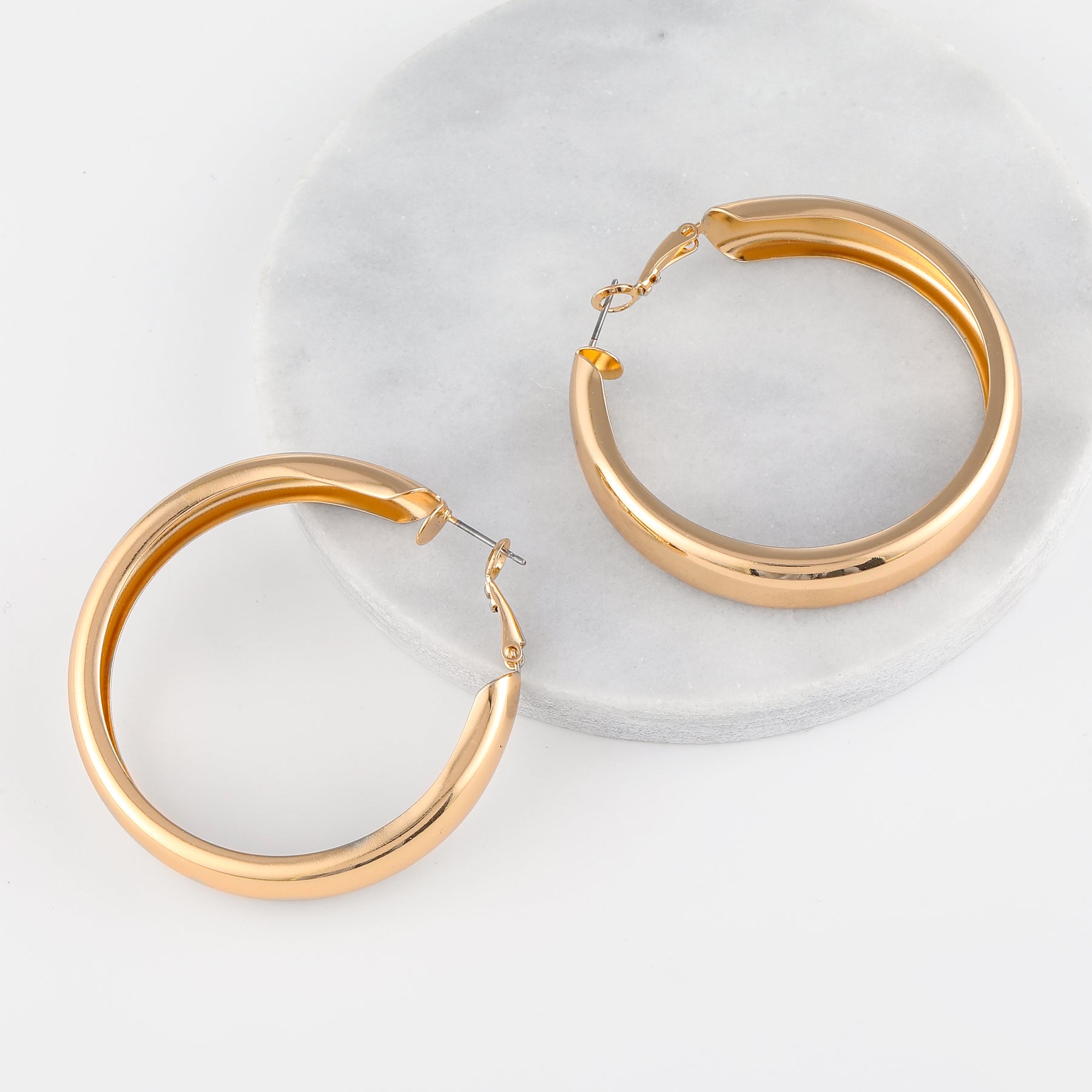 Chunky Hollow Hoop Earrings | Earrings by DORADO
