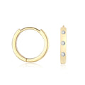 Flush Set Moissanite Huggie Earrings | Earrings by DORADO