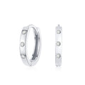 Flush Set Moissanite Huggie Earrings | Earrings by DORADO